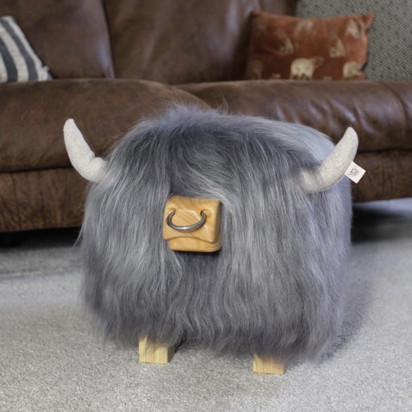Highland bull footstool in stone with a nose ring by Tweed yourself