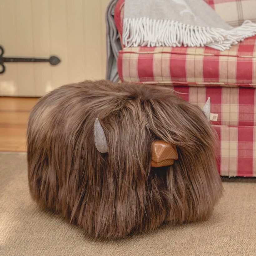 Highland cow sheepskin footstool in ash by Tweed yourself
